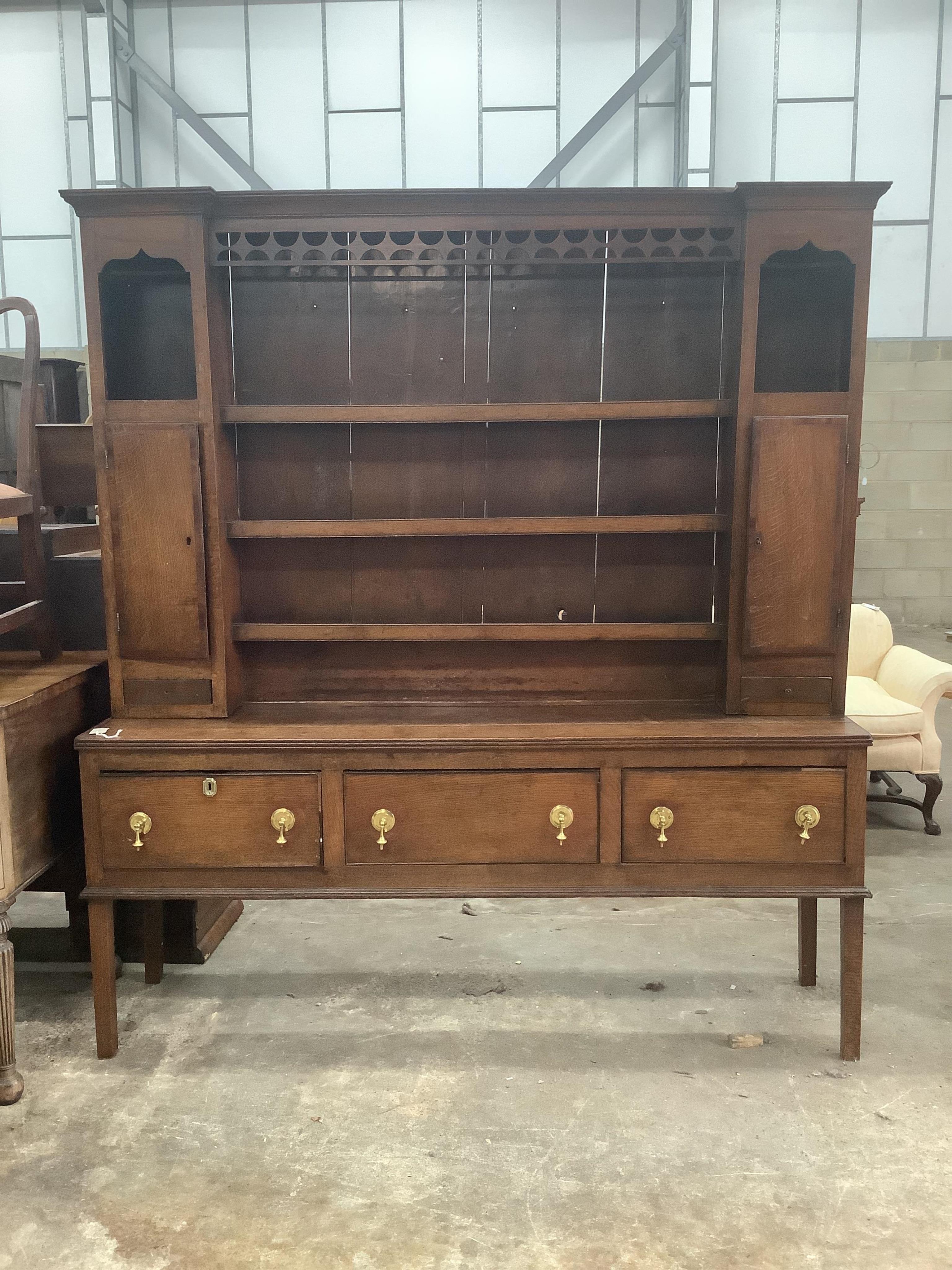 A George III mahogany banded oak dresser with boarded rack, width 182cm, depth 45cm, height 204cm. Condition - fair